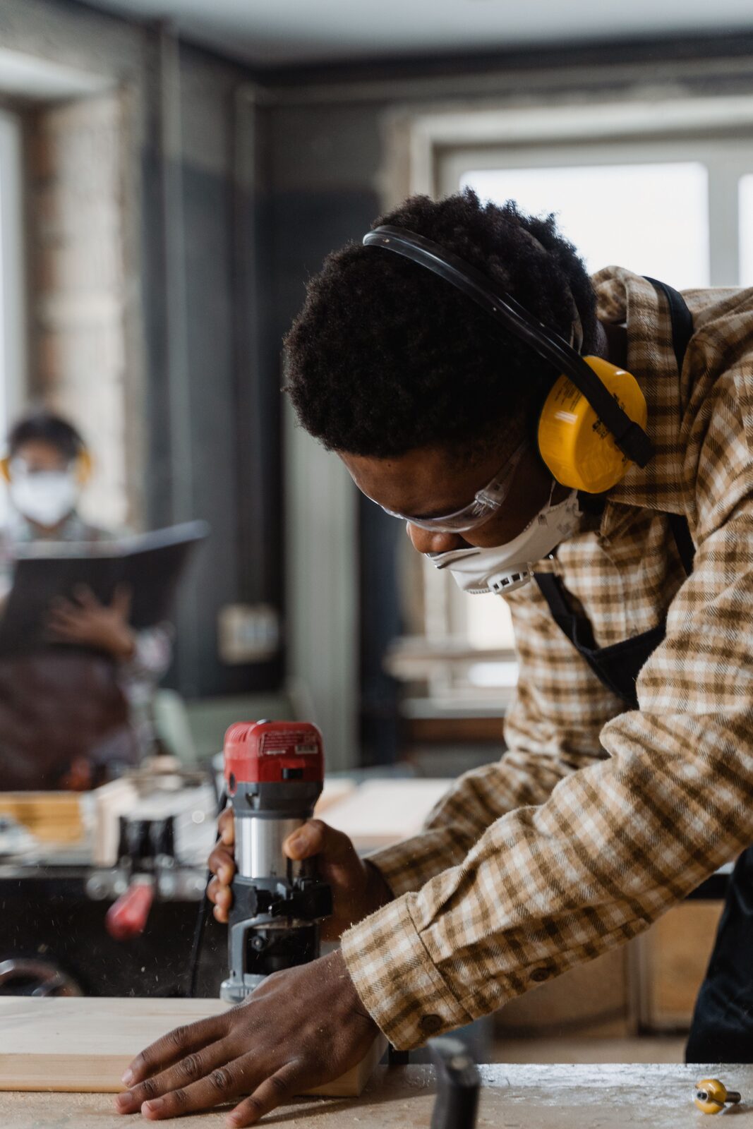 A carpenter working with wood
